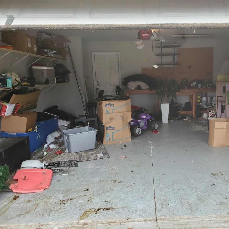 Cluttered garage before a Haul Of Fame home cleanout