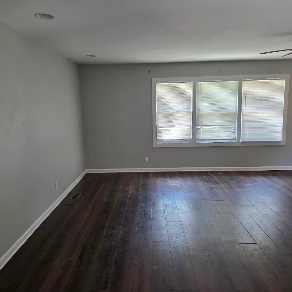 Empty living room after a rental turnover cleanout Empty living room after a rental turnover cleanout