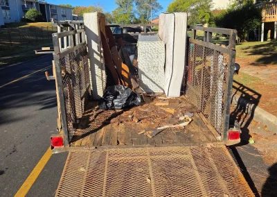 Trailer loaded with debris at a junk removal job - Huntsville area junk removal