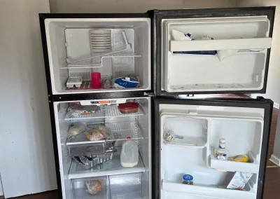 Old refrigerator ready for appliance removal - Huntsville area junk removal