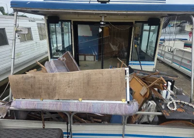 Trailer loaded with furniture and household items - Huntsville area junk removal