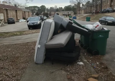 Couch, mattress and trash at the curb for bulk pickup - Huntsville area junk removal