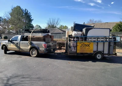 Haul Of Fame truck and loaded trailer - Huntsville area junk removal