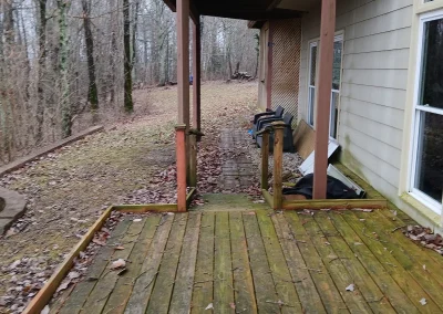 Old deck behind a home - Huntsville area junk removal