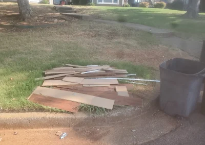 Old lumber and debris in a yard - Huntsville area junk removal