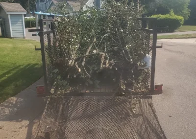 Trailer loaded with brush and limbs - Huntsville area junk removal