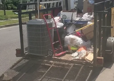 Trailer loaded with household junk - Huntsville area junk removal