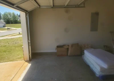 Empty garage after a cleanout - Huntsville area junk removal