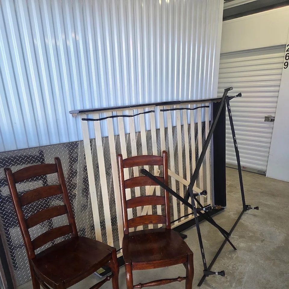 Old chairs and a bed frame ready for removal Old chairs and a bed frame ready for removal
