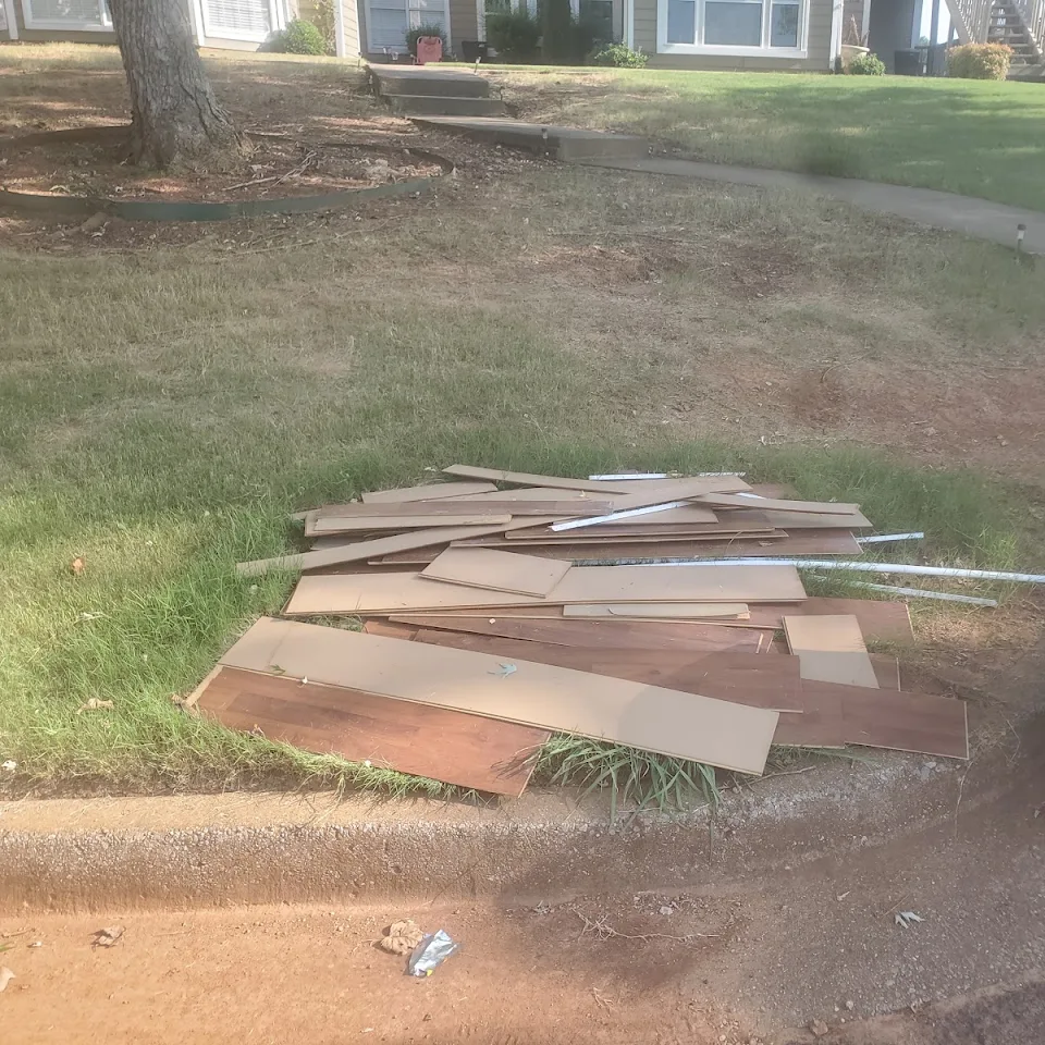 Old lumber and construction debris in a yard ready for cleanup Old lumber and construction debris in a yard ready for cleanup