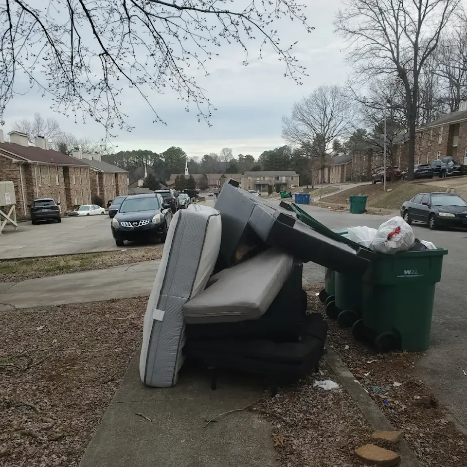 Old mattress, couch and trash at the curb ready for pickup Old mattress, couch and trash at the curb ready for pickup