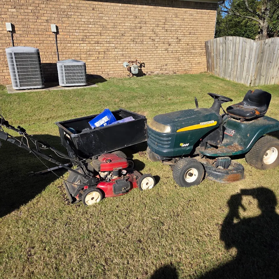 Old riding mower and push mowers ready for removal Old riding mower and push mowers ready for removal