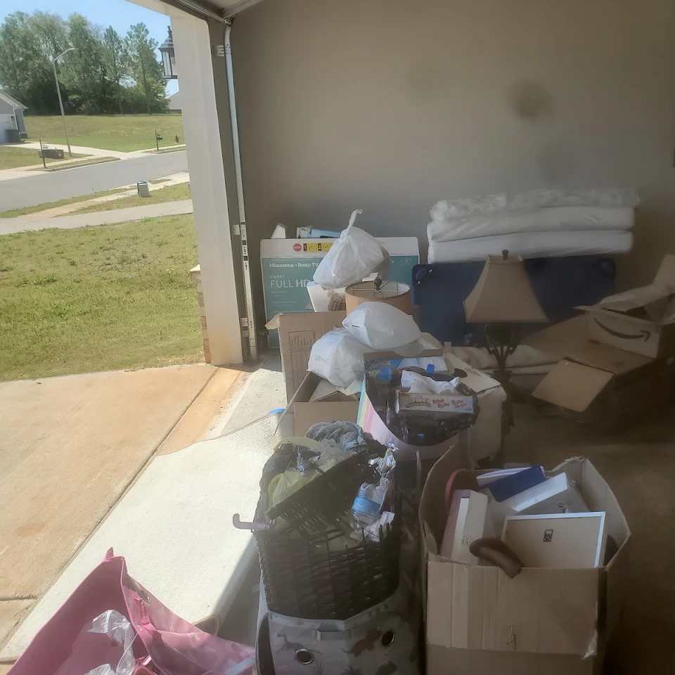 Room full of boxes and belongings before an estate cleanout Room full of boxes and belongings before an estate cleanout