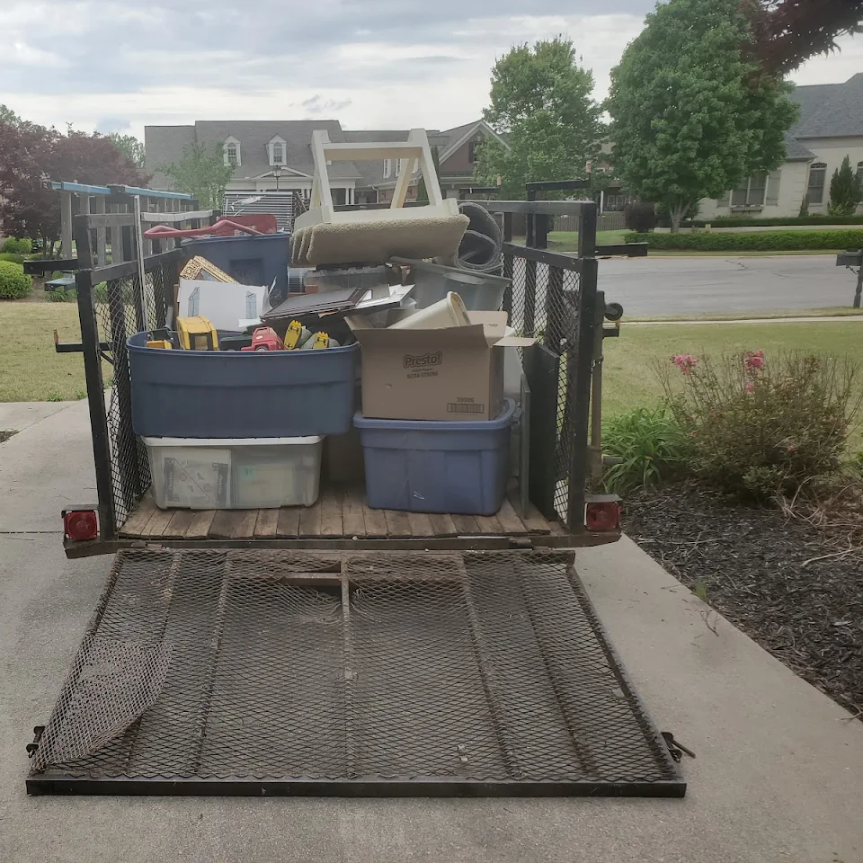 Trailer loaded with bins and household items from a cleanout Trailer loaded with bins and household items from a cleanout
