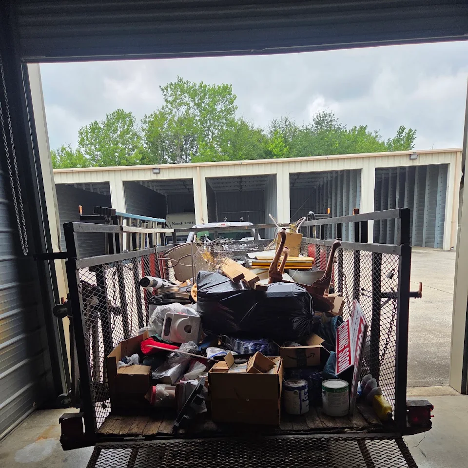 Trailer loaded with household junk at a storage cleanout Trailer loaded with household junk at a storage cleanout